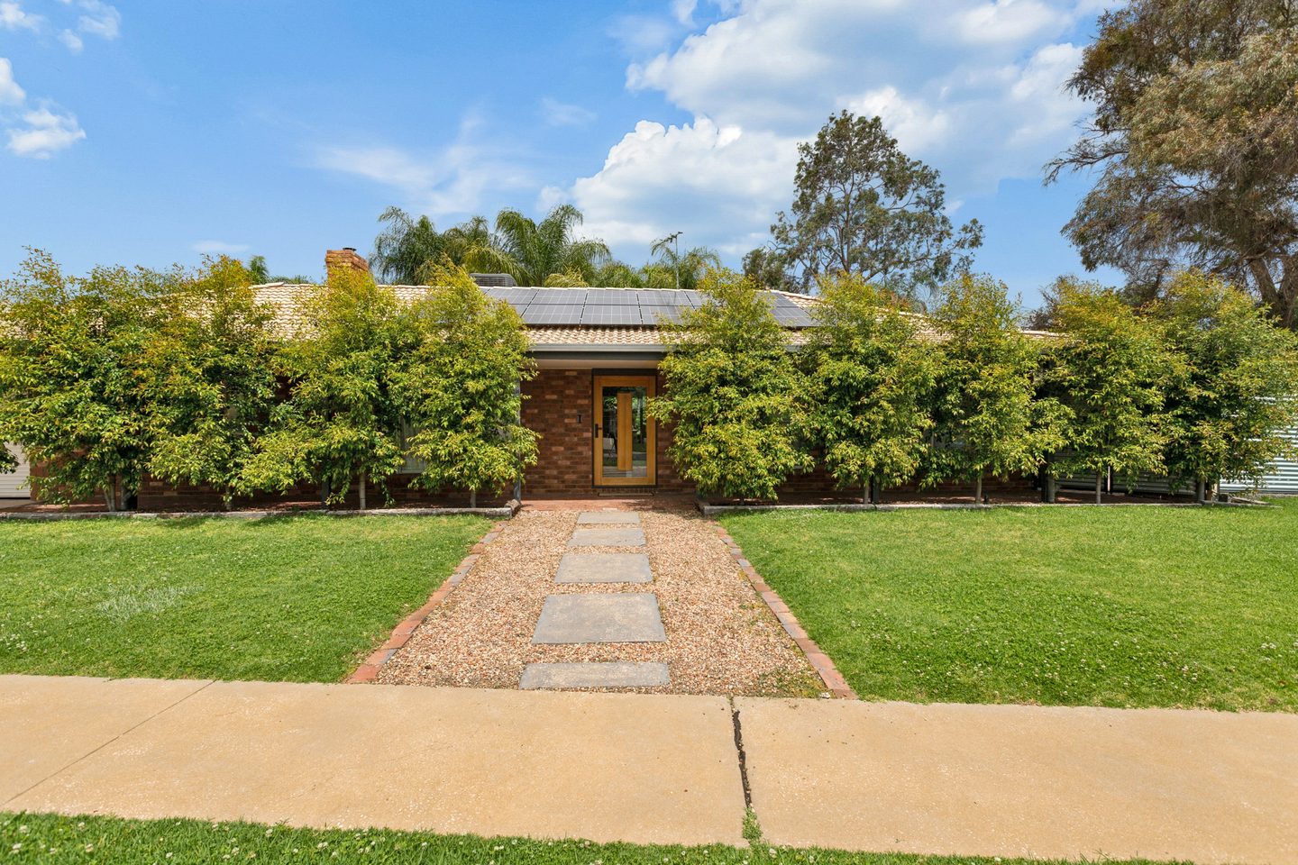 Front garden and brick frontage