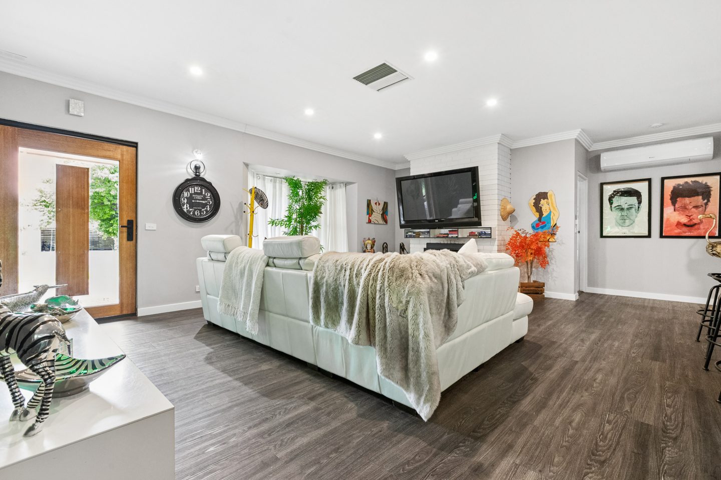 Central living area and slow combustion heater
