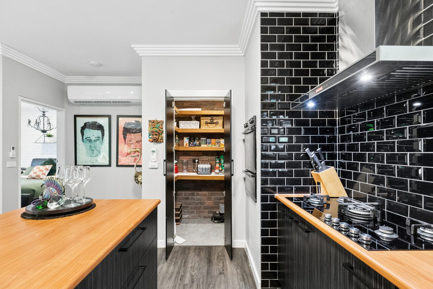 Kitchen with pantry shelving visible