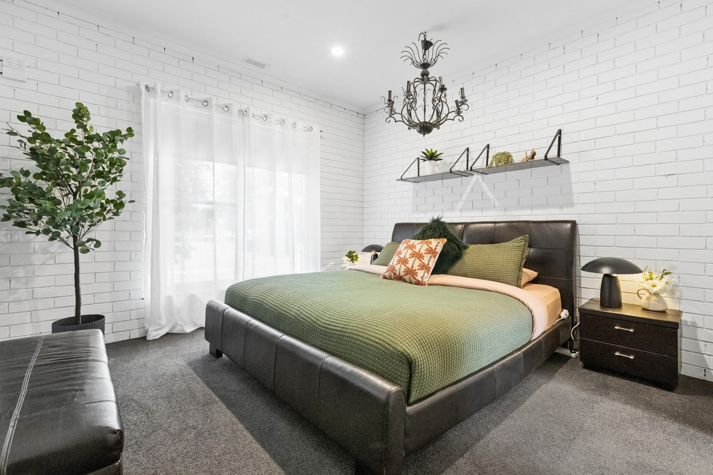 Bedroom with white-painted brick walls