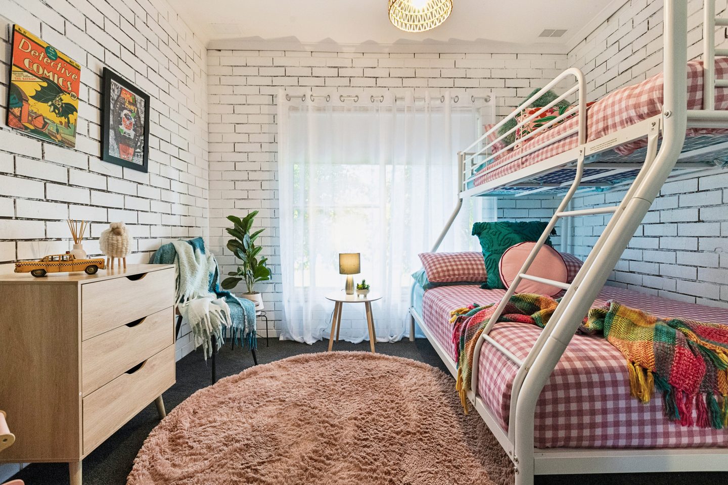 Another view of the bedroom and its white brickwork