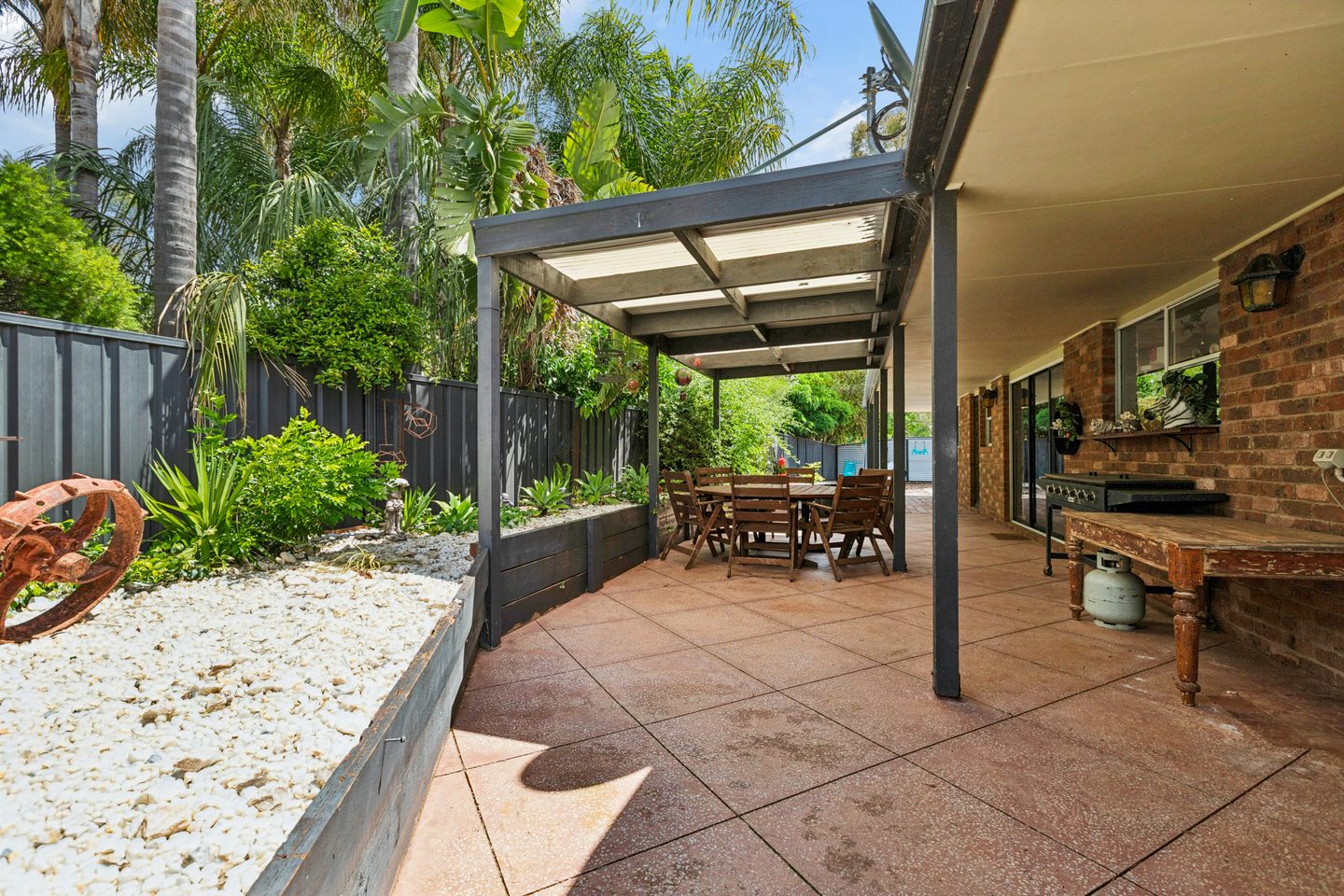 Covered patio and raised garden beds