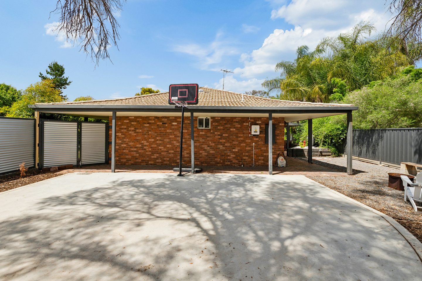 Half basketball court beside the house