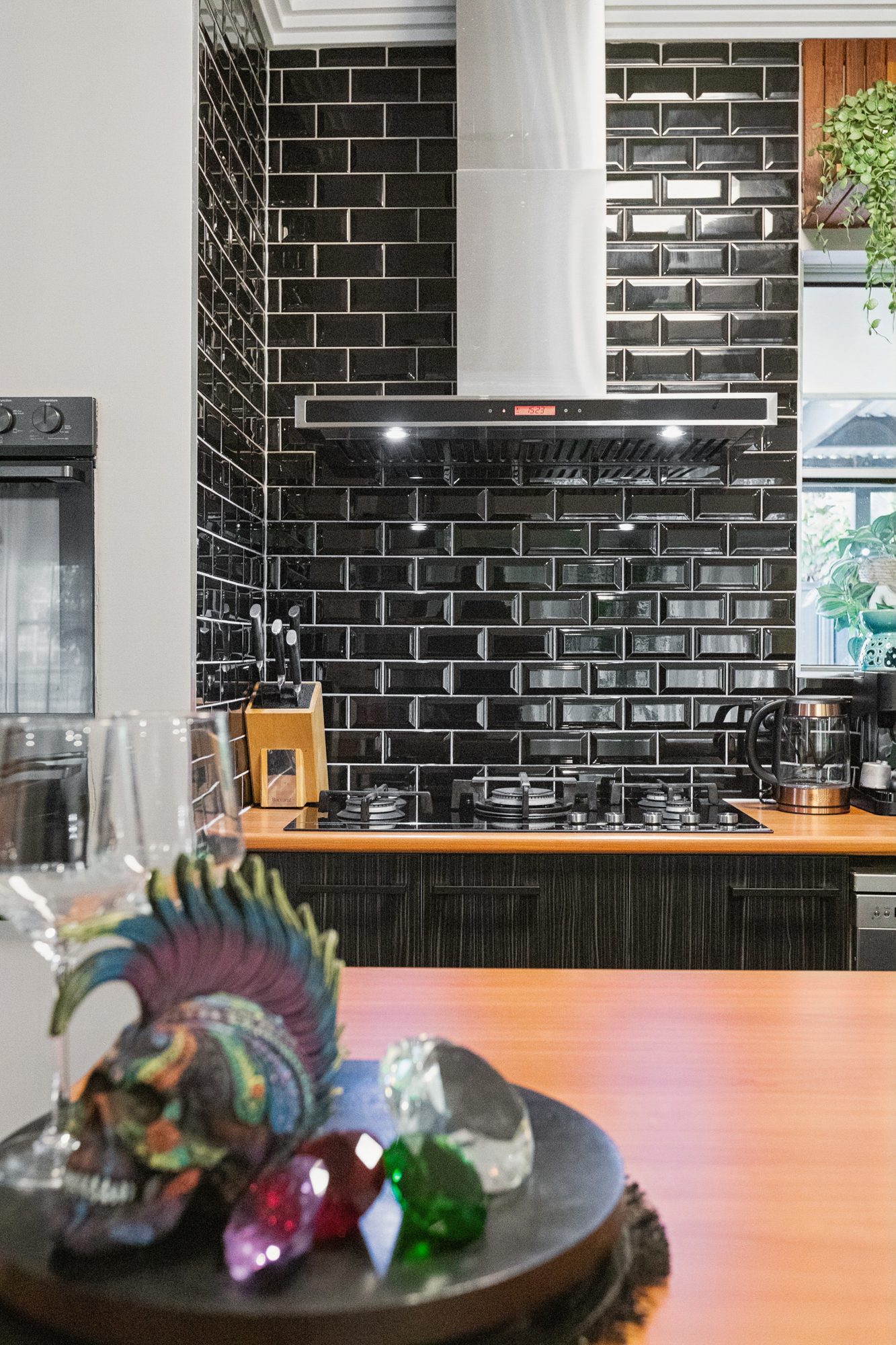 A closer look at the black-tiled kitchen